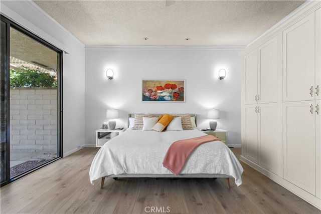 171 Yale Dr, Rancho Mirage, CA 92270 - bedroom with crown molding, light wood-style floors, a textured ceiling, baseboards, and access to exterior