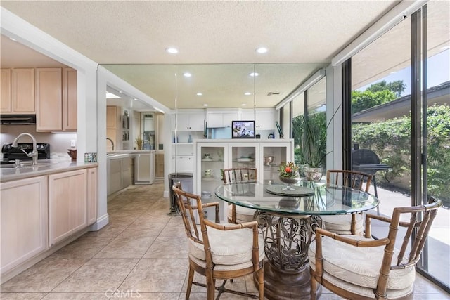 171 Yale Dr, Rancho Mirage, CA 92270 - dining space with a textured ceiling, a wall of windows, light tile patterned flooring, and recessed lighting