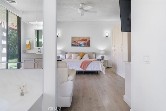 171 Yale Dr, Rancho Mirage, CA 92270 - bedroom featuring light wood finished floors, crown molding, a textured ceiling, and baseboards