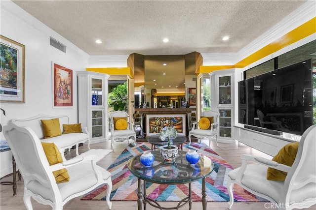171 Yale Dr, Rancho Mirage, CA 92270 - living area with a textured ceiling, ornamental molding, recessed lighting, and wood finished floors