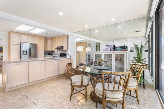 171 Yale Dr, Rancho Mirage, CA 92270 - dining space with light tile patterned floors, recessed lighting, and a textured ceiling