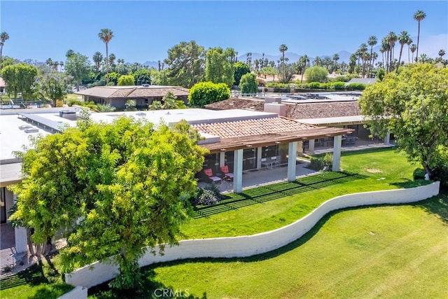 171 Yale Dr, Rancho Mirage, CA 92270 - rear view of house featuring a patio, a tiled roof, a lawn, a mountain view, and stucco siding