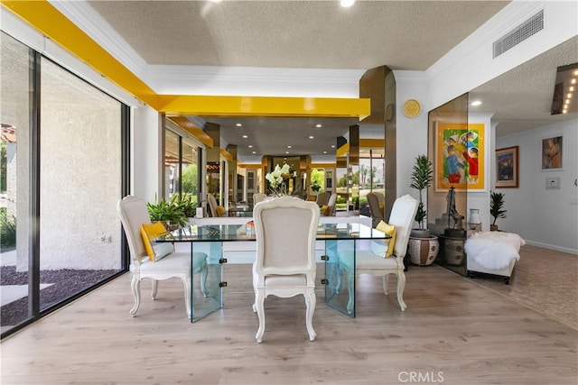171 Yale Dr, Rancho Mirage, CA 92270 - dining space with a textured ceiling, crown molding, and wood finished floors