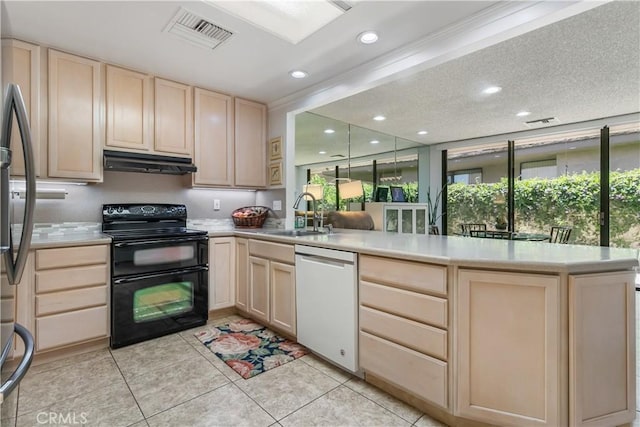 171 Yale Dr, Rancho Mirage, CA 92270 - kitchen with white dishwasher, double oven range, light brown cabinetry, under cabinet range hood, and recessed lighting