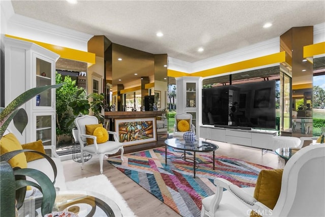 171 Yale Dr, Rancho Mirage, CA 92270 - living room featuring crown molding, a textured ceiling, wood finished floors, and recessed lighting