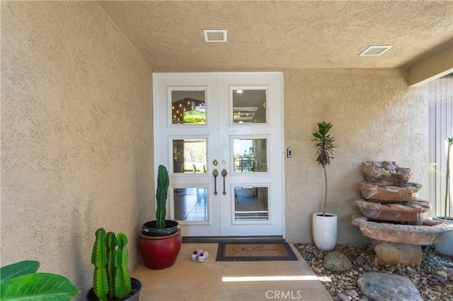 171 Yale Dr, Rancho Mirage, CA 92270 - property entrance featuring french doors and stucco siding