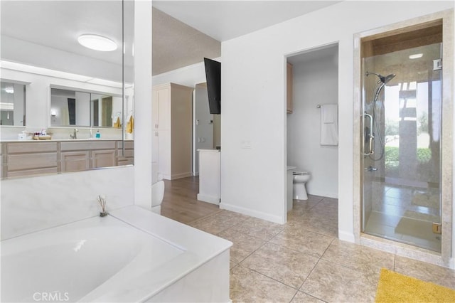 171 Yale Dr, Rancho Mirage, CA 92270 - full bath with a shower stall, a bath, vanity, toilet, and baseboards