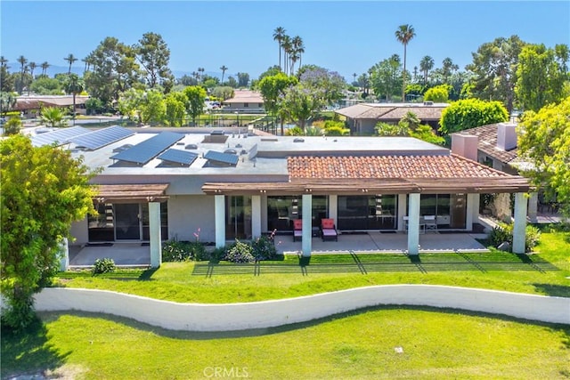171 Yale Dr, Rancho Mirage, CA 92270 - rear view of house featuring a patio, a yard, and stucco siding