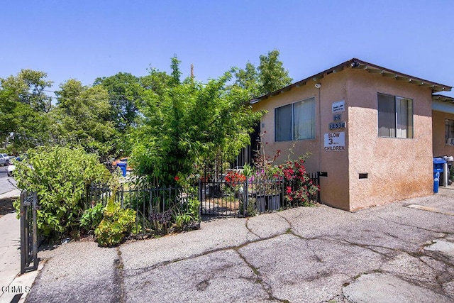 12528 Bradley Ave, Los Angeles, CA 91342 - view of property exterior with stucco siding