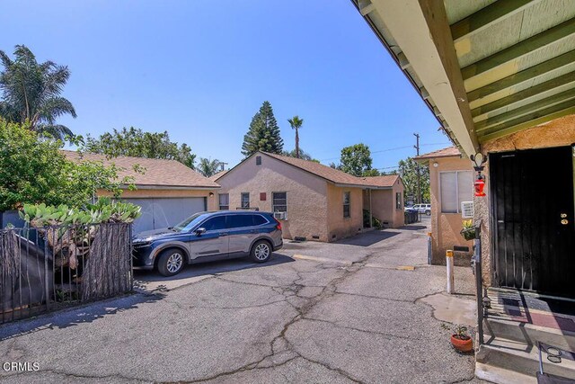 12528 Bradley Ave, Los Angeles, CA 91342 - view of side of home with a garage
