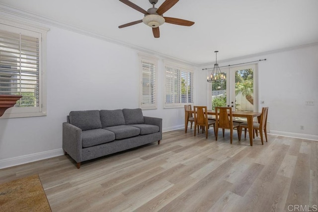 8375 Gold Coast Dr Unit 4, San Diego, CA 92126 - living room with baseboards, light wood-type flooring, ornamental molding, a ceiling fan, and a chandelier