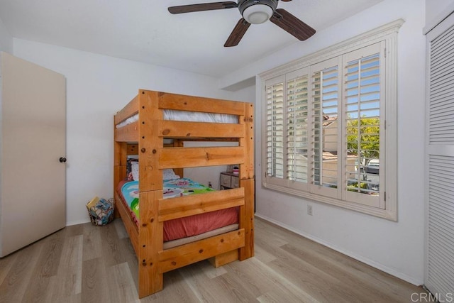 8375 Gold Coast Dr Unit 4, San Diego, CA 92126 - bedroom with wood finished floors, baseboards, and a ceiling fan