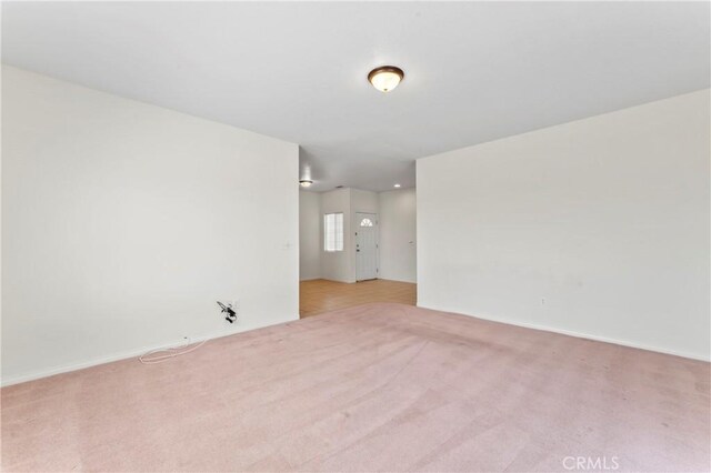 7841 Fernwood Ave, California City, CA 93505 - empty room featuring light colored carpet