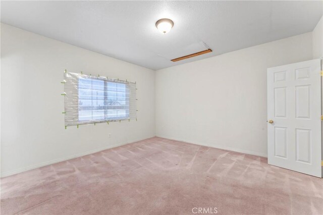 7841 Fernwood Ave, California City, CA 93505 - spare room featuring light carpet and baseboards