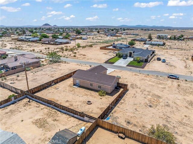7841 Fernwood Ave, California City, CA 93505 - aerial view of sparsely populated area featuring a desert landscape and a mountainous background
