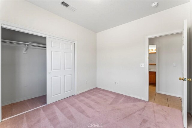 7841 Fernwood Ave, California City, CA 93505 - unfurnished bedroom with carpet flooring, a closet, and baseboards
