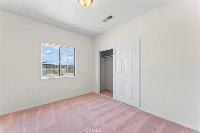 7841 Fernwood Ave, California City, CA 93505 - unfurnished bedroom featuring carpet flooring, baseboards, and a closet