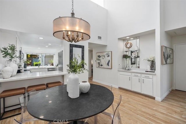 4 Dogwood N, Irvine, CA 92612 - dining space featuring light wood-type flooring, baseboards, a chandelier, and recessed lighting