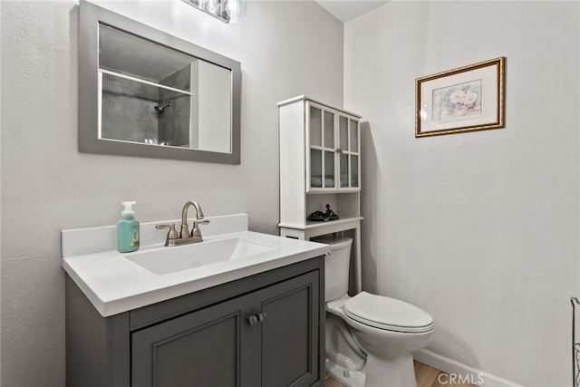 2619 S Castle Harbour Ave, Ontario, CA 91761 - full bathroom with toilet, vanity, a shower, and wood finished floors