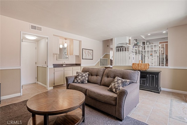 2619 S Castle Harbour Ave, Ontario, CA 91761 - living room with light tile patterned floors, baseboards, stairway, and recessed lighting