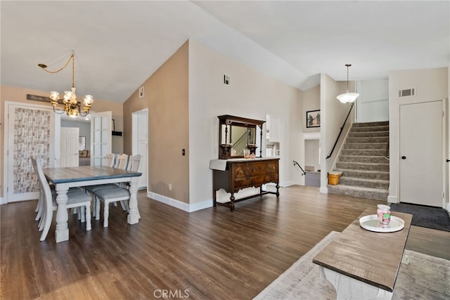 2619 S Castle Harbour Ave, Ontario, CA 91761 - dining area featuring lofted ceiling, a chandelier, baseboards, stairs, and wood finished floors