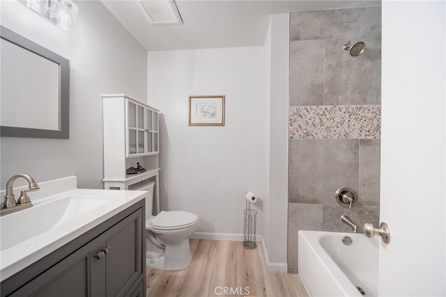 2619 S Castle Harbour Ave, Ontario, CA 91761 - full bath with vanity, wood finished floors, toilet, shower / bathtub combination, and baseboards