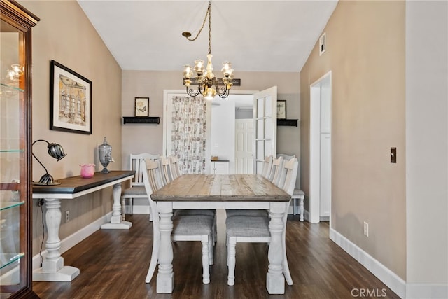 2619 S Castle Harbour Ave, Ontario, CA 91761 - dining space with a chandelier, baseboards, and dark wood finished floors