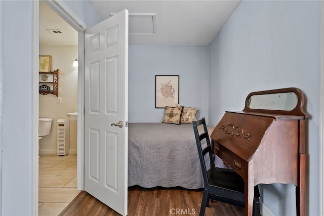 2619 S Castle Harbour Ave, Ontario, CA 91761 - bedroom with wood finished floors and attic access