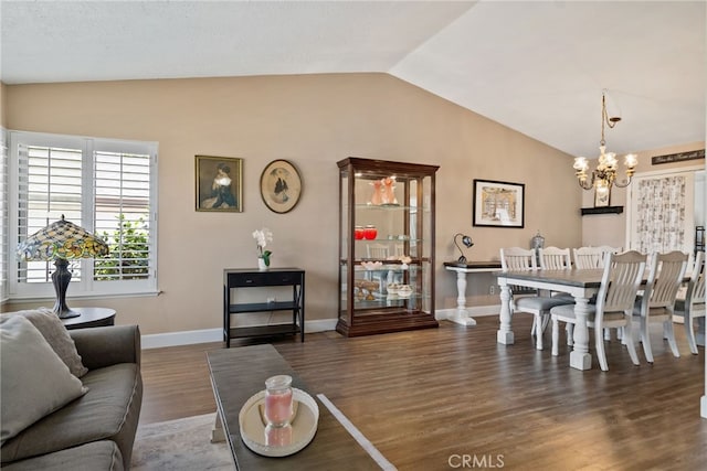 2619 S Castle Harbour Ave, Ontario, CA 91761 - dining area featuring lofted ceiling, wood finished floors, a chandelier, and baseboards