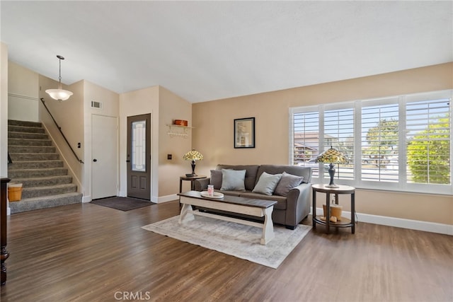 2619 S Castle Harbour Ave, Ontario, CA 91761 - living room with baseboards, dark wood-style flooring, stairs, and vaulted ceiling
