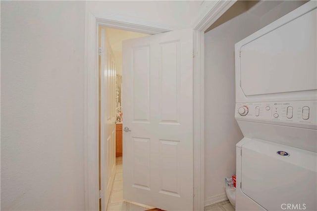 735 Francesca Dr, Walnut, CA 91789 - laundry room featuring stacked washer / drying machine and baseboards