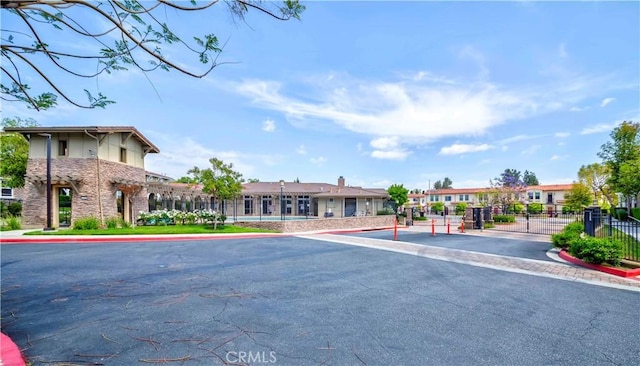 735 Francesca Dr, Walnut, CA 91789 - view of asphalt road featuring a residential view, curbs, a gate, and a gated entry