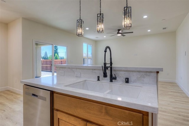 6210 Himmel St, Paradise, CA 95969 - kitchen with dishwasher, a sink, light wood-style floors, decorative light fixtures, and recessed lighting