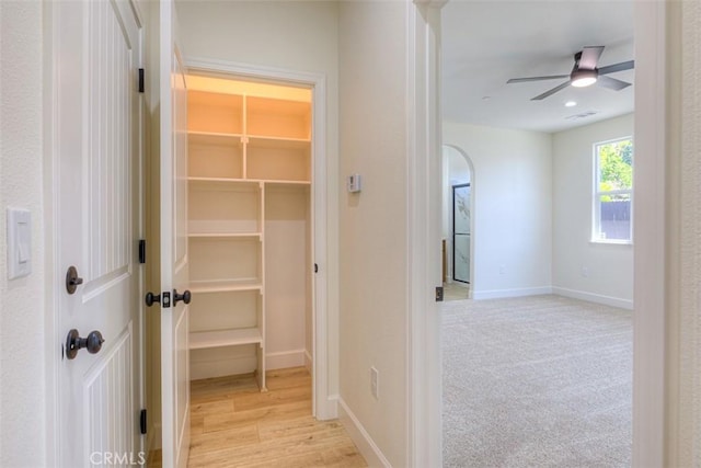 6210 Himmel St, Paradise, CA 95969 - corridor featuring baseboards and light wood finished floors
