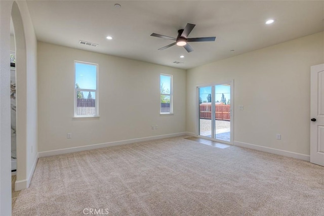 6210 Himmel St, Paradise, CA 95969 - empty room featuring light carpet, a ceiling fan, arched walkways, recessed lighting, and baseboards