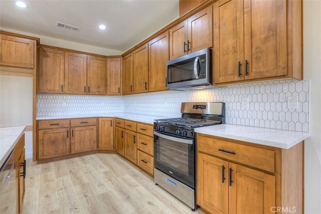 6210 Himmel St, Paradise, CA 95969 - kitchen with appliances with stainless steel finishes, brown cabinets, light countertops, and recessed lighting
