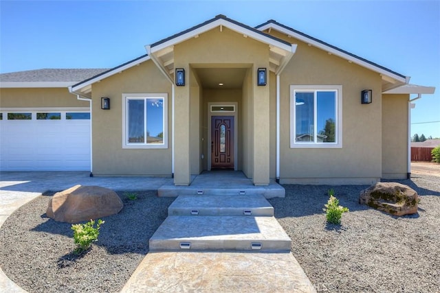6210 Himmel St, Paradise, CA 95969 - view of front of home featuring stucco siding, a garage, and concrete driveway