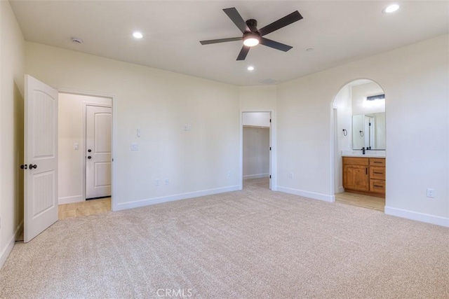 6210 Himmel St, Paradise, CA 95969 - unfurnished bedroom with light colored carpet, arched walkways, recessed lighting, baseboards, and ensuite bathroom