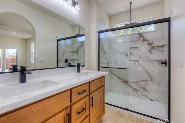 6210 Himmel St, Paradise, CA 95969 - bathroom with double vanity, a marble finish shower, and wood finished floors