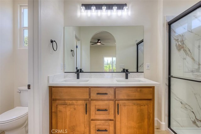 6210 Himmel St, Paradise, CA 95969 - full bath featuring a marble finish shower, double vanity, ceiling fan, and toilet