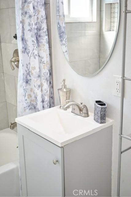 68600 E St, Cathedral City, CA 92234 - full bath featuring vanity and shower / bathtub combination with curtain