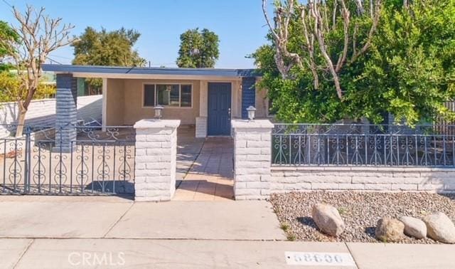 68600 E St, Cathedral City, CA 92234 - single story home with a fenced front yard and stucco siding