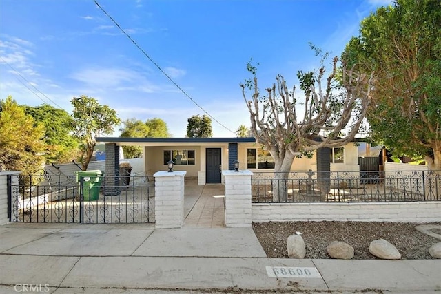 68600 E St, Cathedral City, CA 92234 - view of front of home featuring a fenced front yard and stucco siding