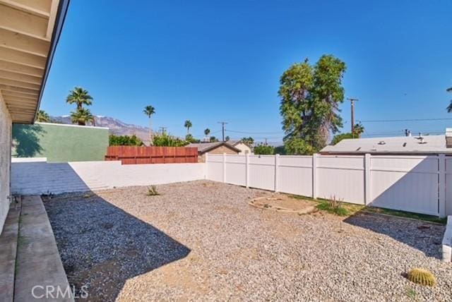 68600 E St, Cathedral City, CA 92234 - fenced backyard featuring a mountain view
