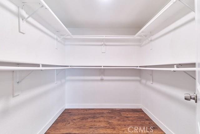 68600 E St, Cathedral City, CA 92234 - spacious closet with dark wood-style floors