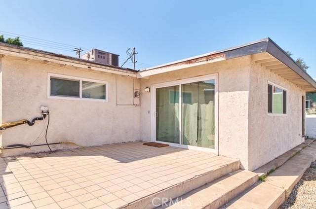 68600 E St, Cathedral City, CA 92234 - back of house featuring stucco siding and a patio
