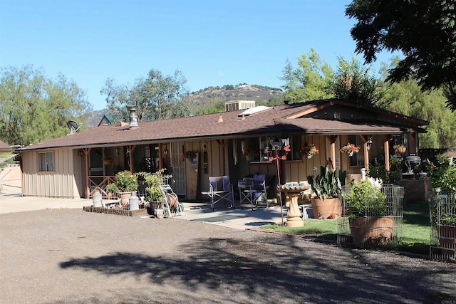 13853 Charlann Rd, Valley Center, CA 92082 - rear view of house with board and batten siding, a patio, and central air condition unit