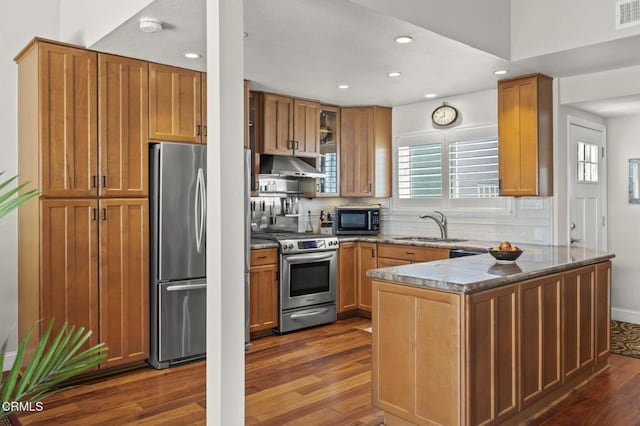 483 Broderick Way, Port Hueneme, CA 93041 - kitchen featuring black appliances, under cabinet range hood, a peninsula, a sink, and dark wood-style flooring