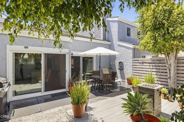 483 Broderick Way, Port Hueneme, CA 93041 - back of property with a deck, stucco siding, and outdoor dining area