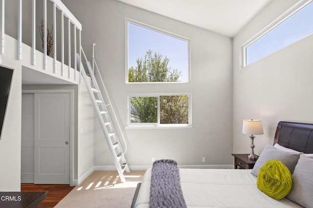 483 Broderick Way, Port Hueneme, CA 93041 - bedroom featuring a towering ceiling, baseboards, and wood finished floors